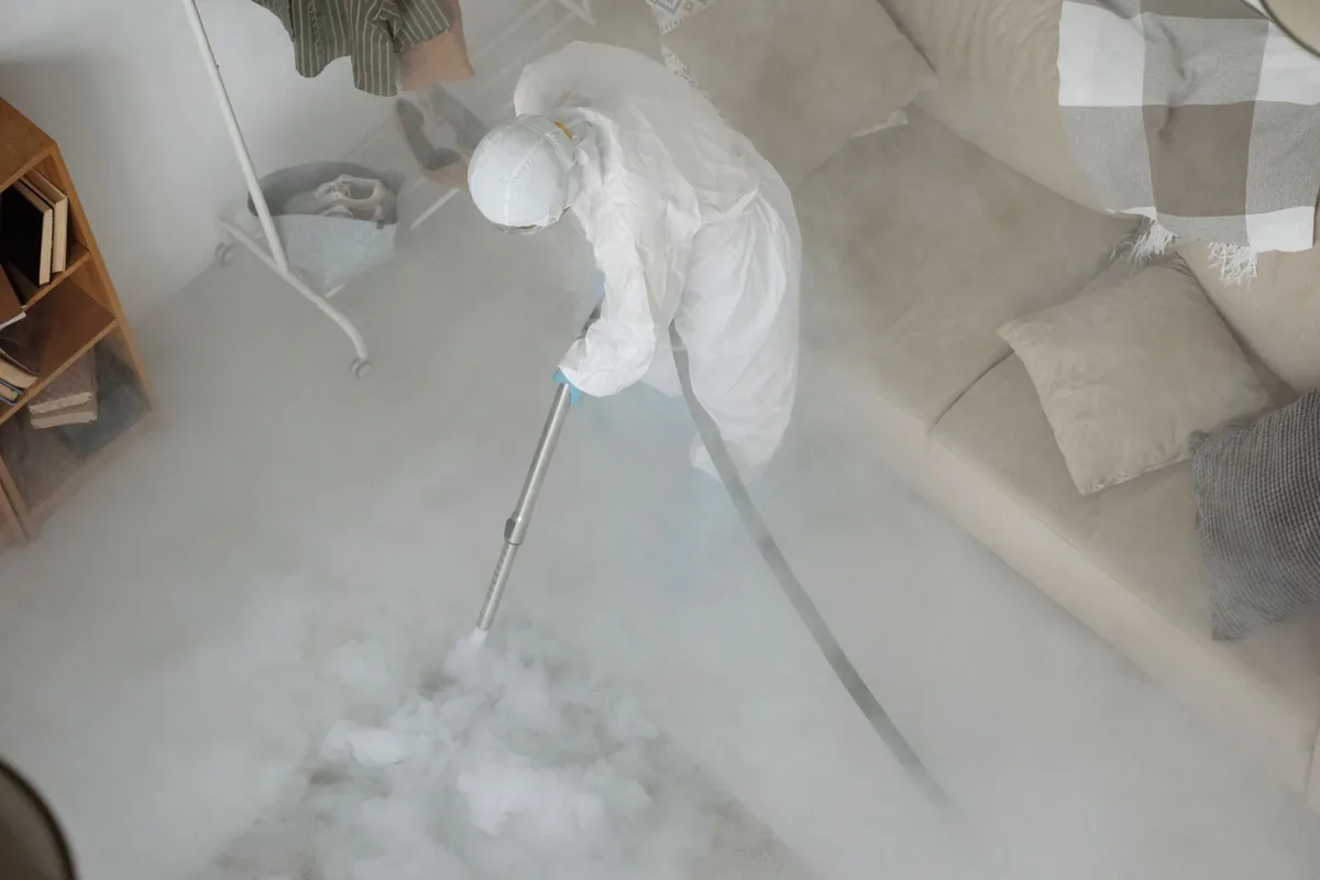 Biohazard cleanup technician in protective equipment, Enigma, GA